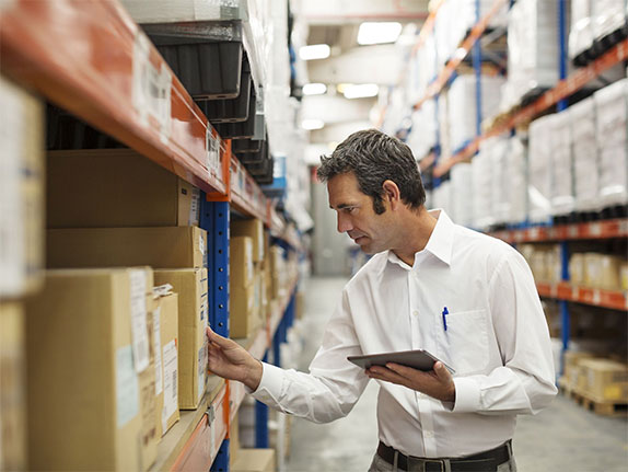 man checking on supply chain warehouse