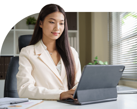 Thai Asian professional using Microsoft Dynamics 365 Finance